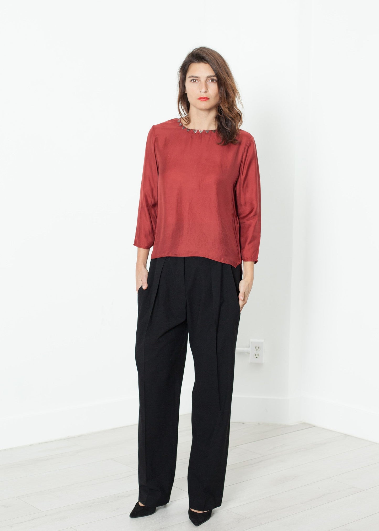 Pantaloni in vita con pieghe in nero